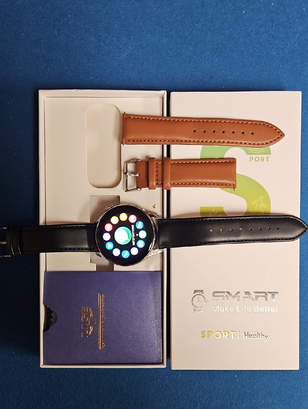 Round Smartwatch with Black Leather Strap and Brown Replacement Band
